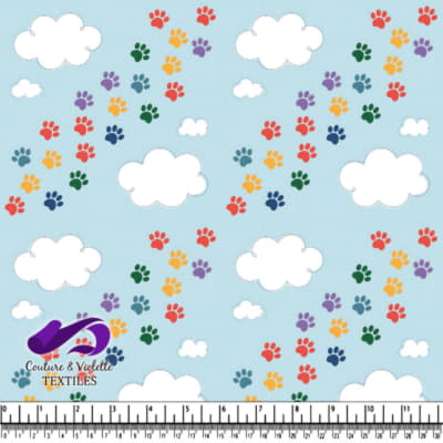 Colorful paw prints pattern on light blue background