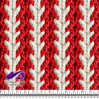 Close up of red and white knitted textured fabric with arrow pattern